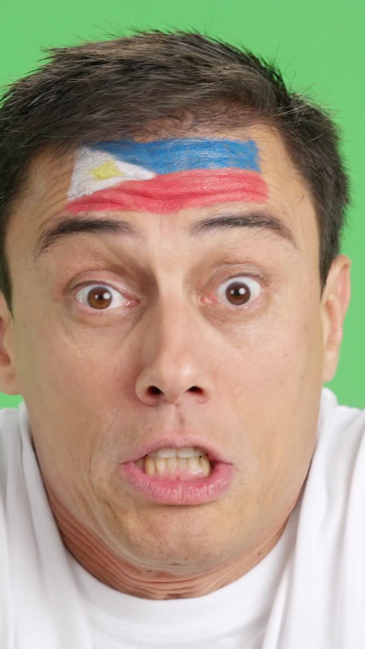 Man with philippine national flag upset with a referee