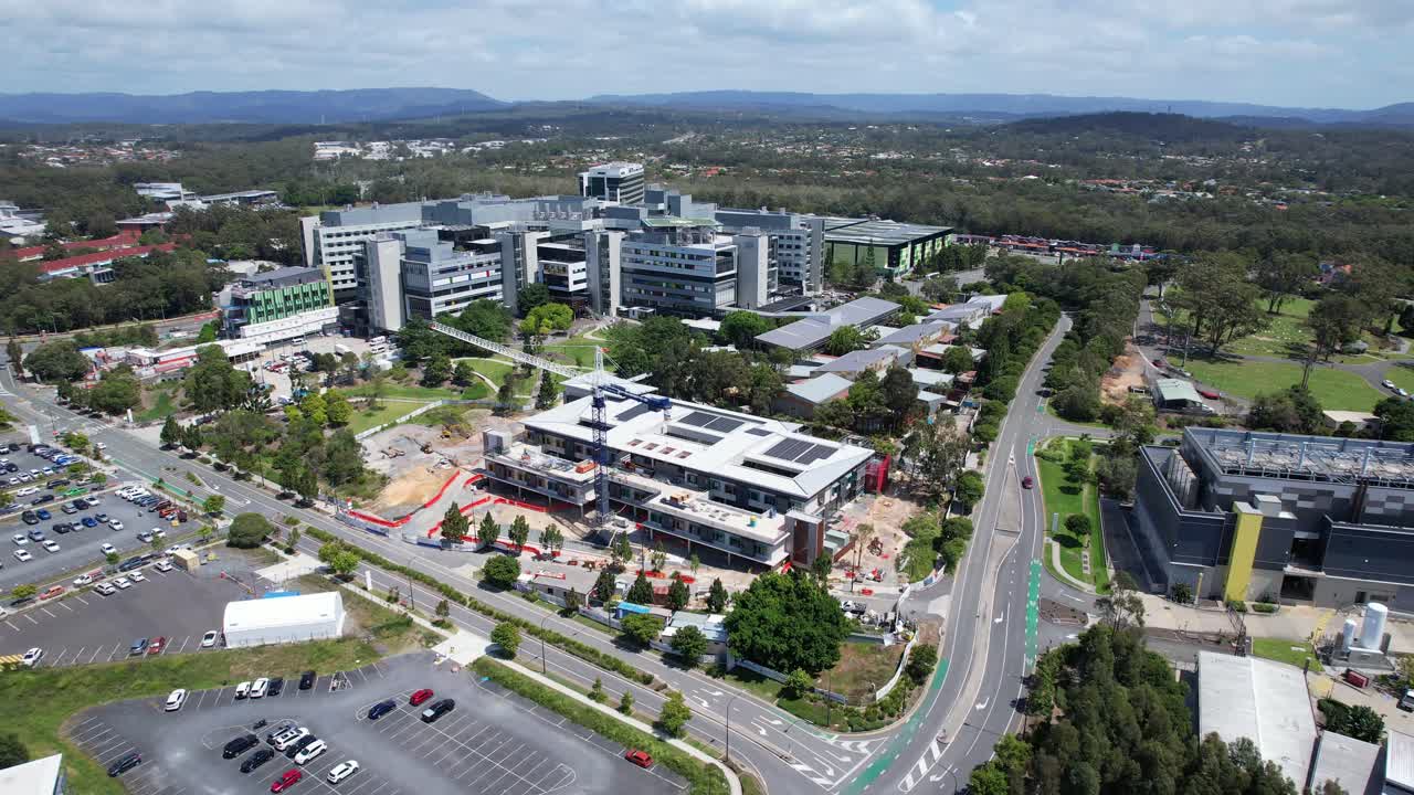 Aerial View of Hospital and University Campus Under Construction