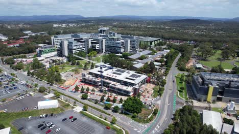 aerial view of hospital and university campus under construction