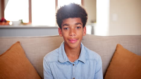 happy teenager sitting on a couch