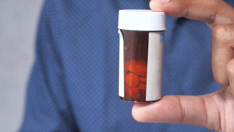 person holding a pill bottle