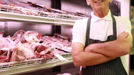 Senior-worker-stocking-fridge-in-the-supermarket