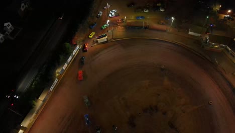 racecars line up to leave oval dirt track after a race - oval dirt track