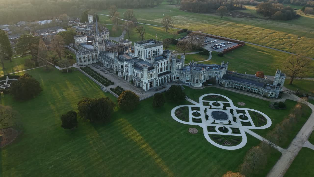 Aerial view of Ashridge House in Hertfordshire, UK amidst lush greenery