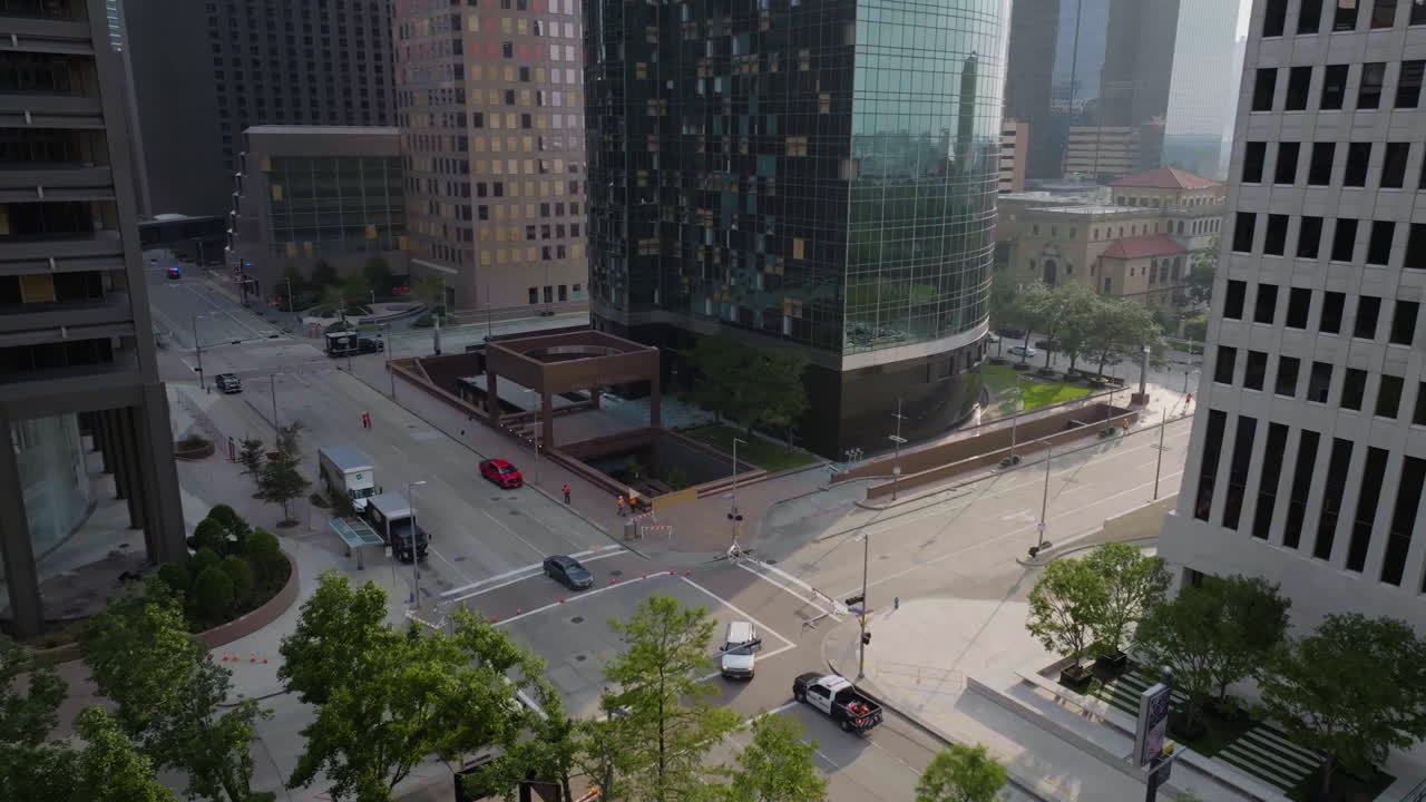 AERIAL: Workers repairing multiple buildings damaged by a storm, in Houston, USA