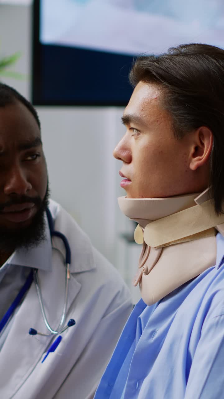 Vertical video: Doctor checking patient eye vision