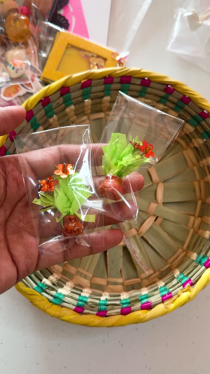 Miniature flowers in cellophane for crafting, evoking creativity