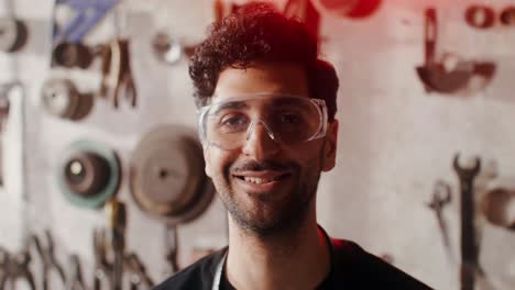 smiling mechanic in a workshop