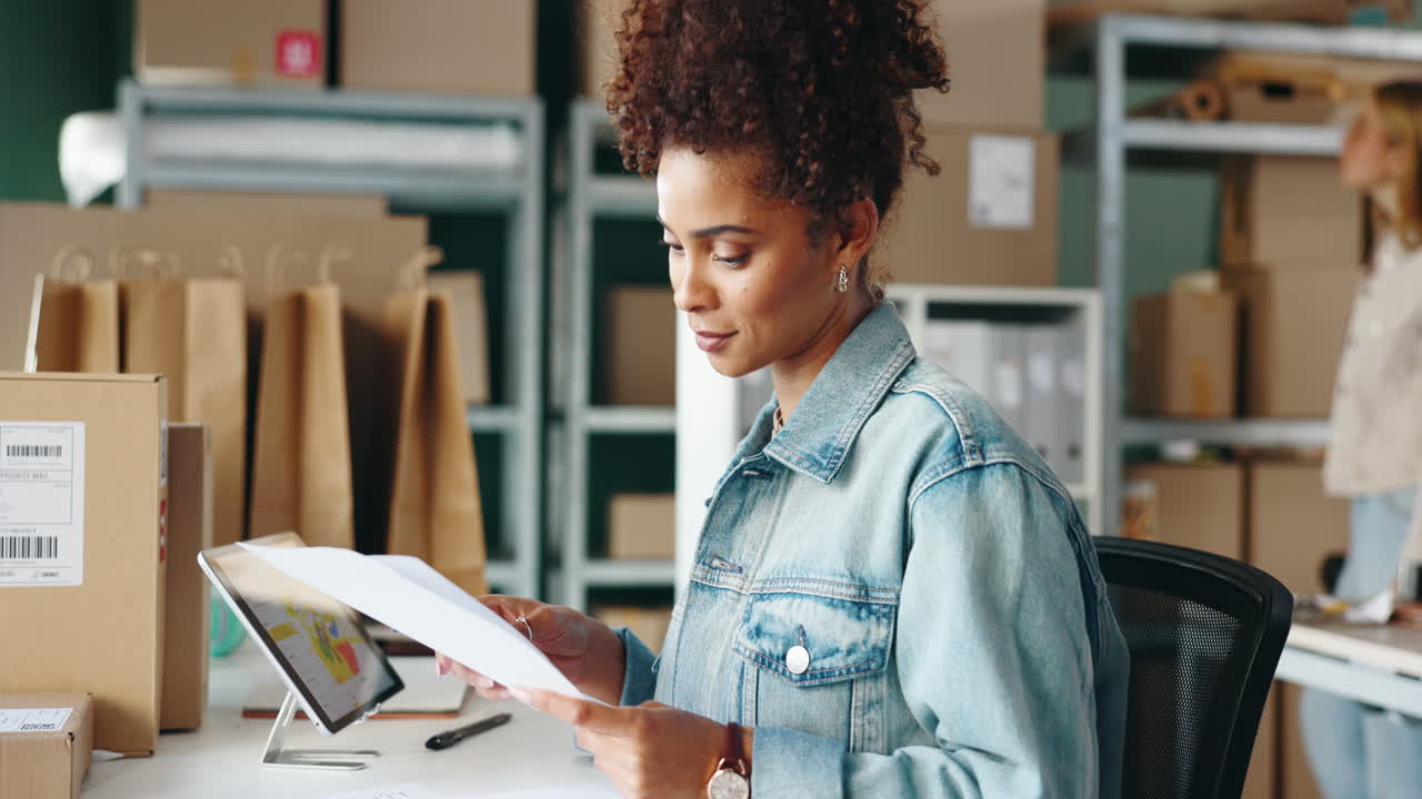 Woman managing small business orders in office