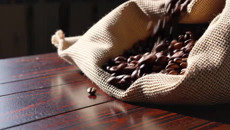 coffee beans pouring from burlap bag