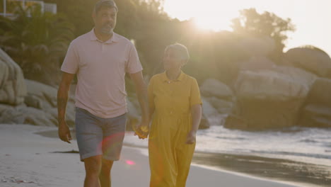 Retirement,-couple-and-walking-on-beach