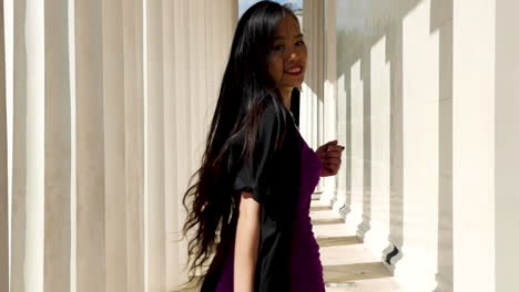 girl walks away, turn around and looking into camera, slow motion