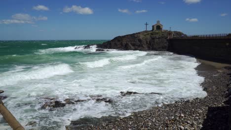 heavy waves pound the coastal defences of collioure during a very windy day