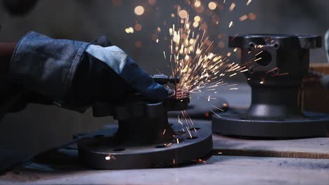 industrial-safety-first-concept,-Worker-cutting-metal-with-grinder