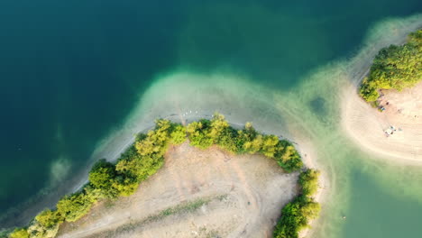 aerial view of a lakeside park with people