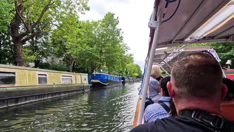 passengers enjoy a scenic canal boat ride