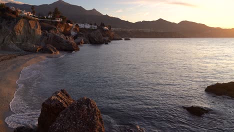 Locked-off-nature-shot-at-ocean-with-beach-in-Nerja,-Spain