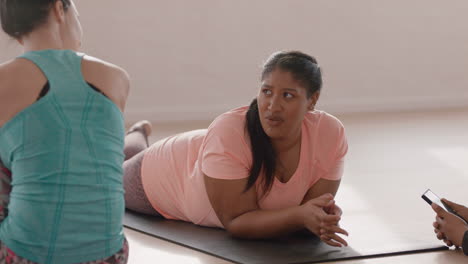 gym class young overweight woman chatting to friends socializing sharing lifestyle enjoying conversation in workout studio