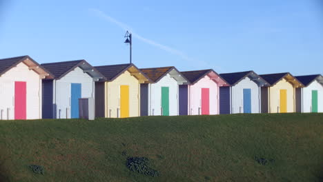 pretty colorful beach huts in summer