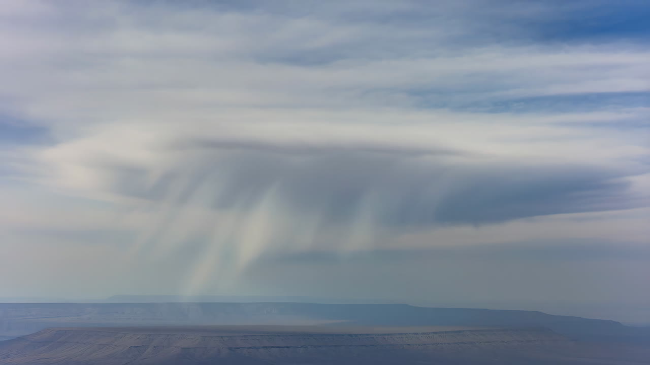 Landscape with rain cloud and mountains