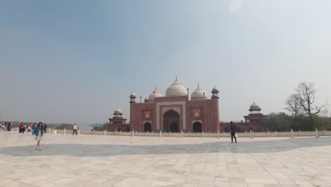 tourists on the grounds of the magnificent taj mahal, agra, india