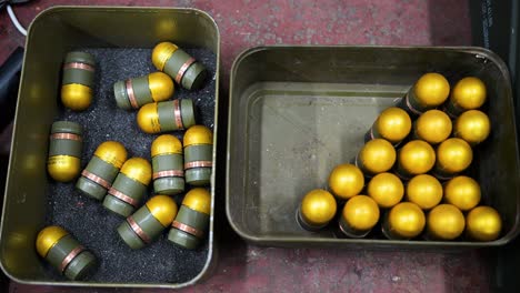 donetsk region, ukraine: grenades get plastic casings at a drone workshop for aerial attachment. adaptive weapon production redefines modern warfare.