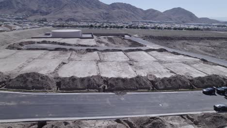 A-drone-gracefully-flies-over-a-cluster-of-freshly-flattened-lots,-meticulously-prepared-and-awaiting-the-commencement-of-home-constructions