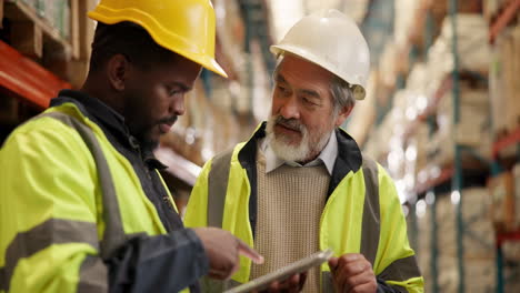 warehouse workers using tablet for inventory management