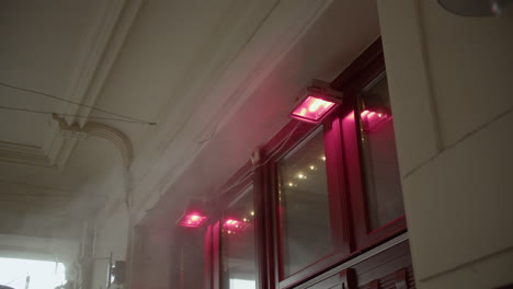 pink and red lights on building exterior at night