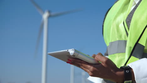 wind farm engineer using tablet