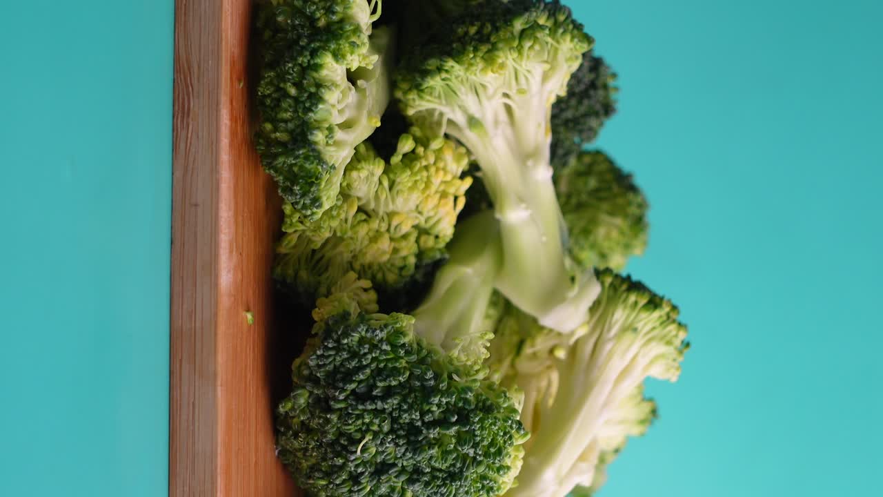 Fresh Broccoli on Wooden Cutting Board