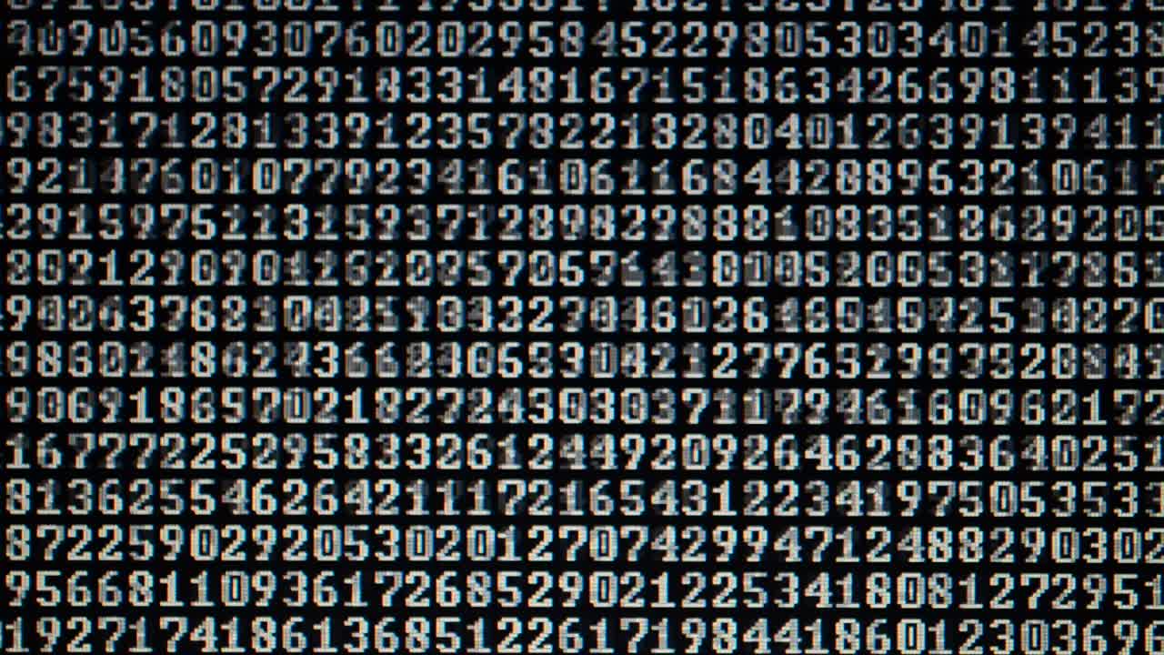Binary code on the monitor screen. Shooting of a binary code, background