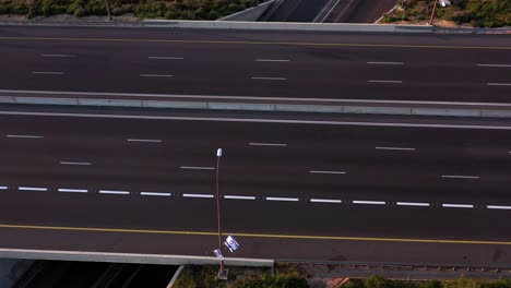 aerial view of an empty multi-lane highway with road markings