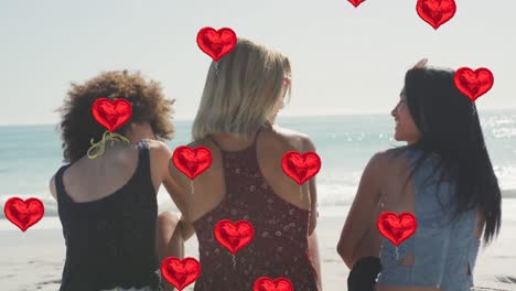 Animation-of-heart-digital-icons-over-female-friends-on-beach