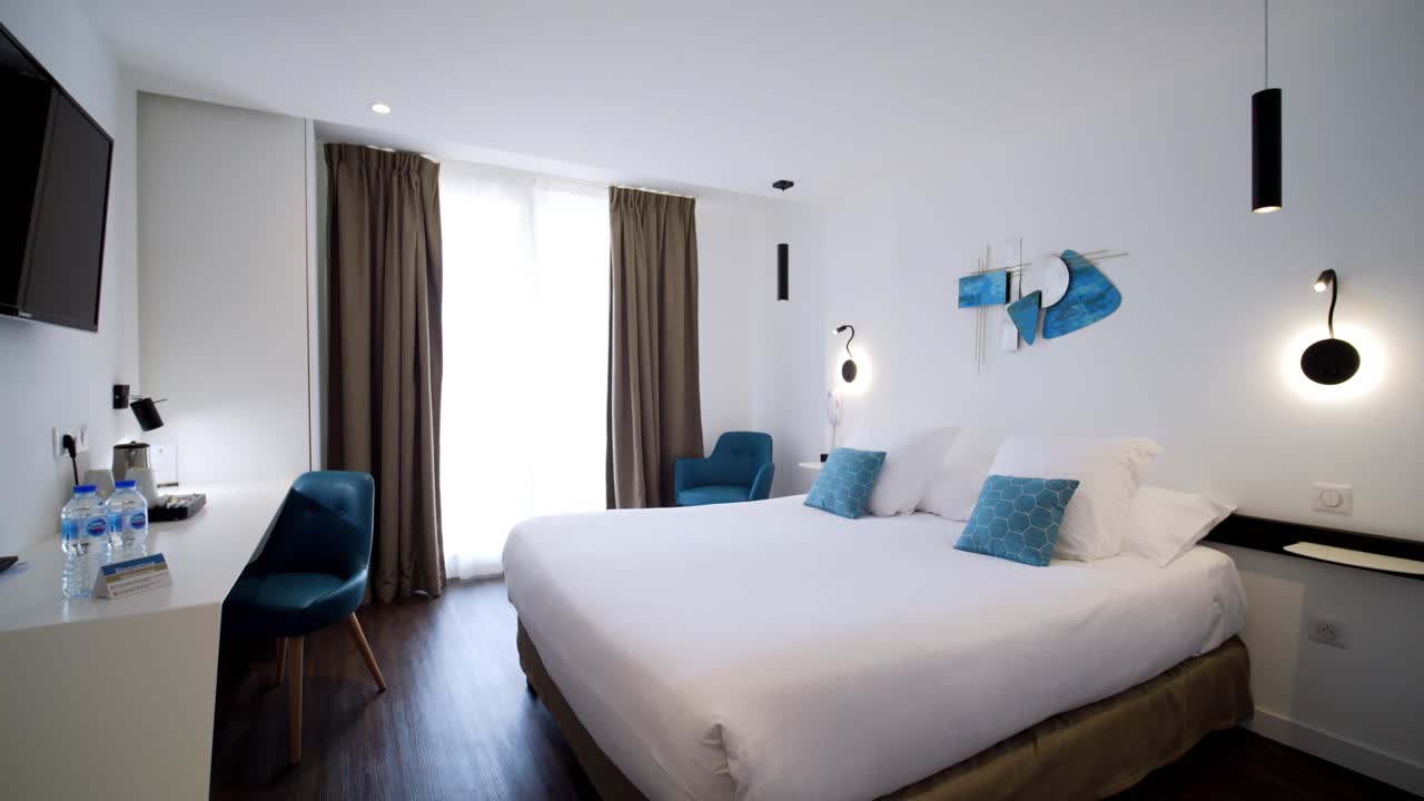 Slow rising shot revealing a double room within a luxury spa in the French countryside