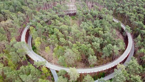 Drone-shot-of-a-tourist-attraction-in-Belgium-"cycling-though-the-trees"