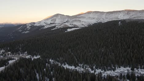 Aerial-footage-over-Highway-9-at-sunset-with-Hoosier-Ridge-and-Red-Mountain-in-the-background