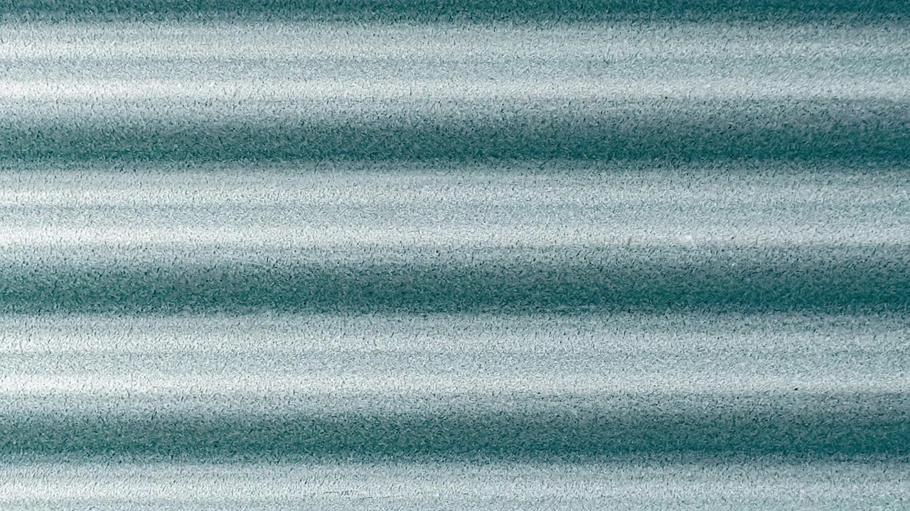 Sfondo astratto con texture in metallo ondulato