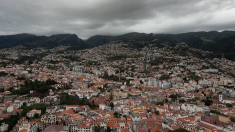 dark clouds over the town of canico in funchal, madeira island, portugal