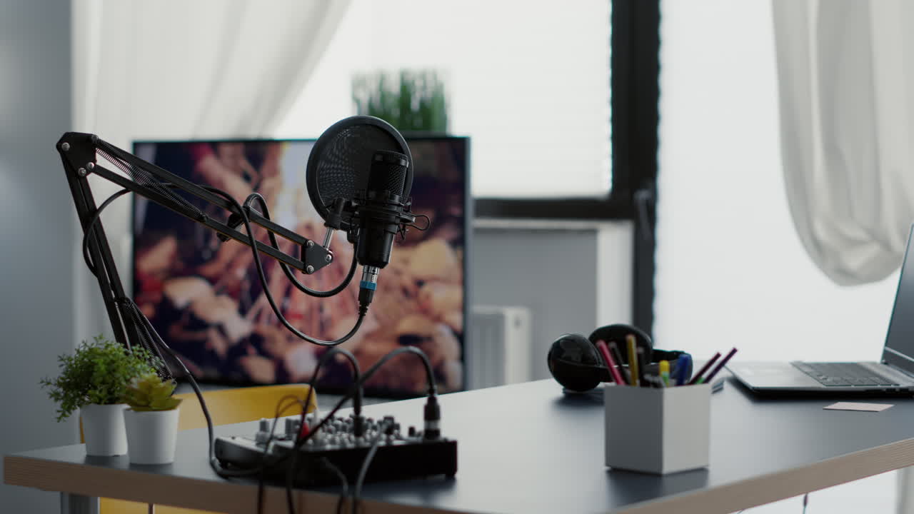 Empty broadcasting studio with professional audio equipment and no host