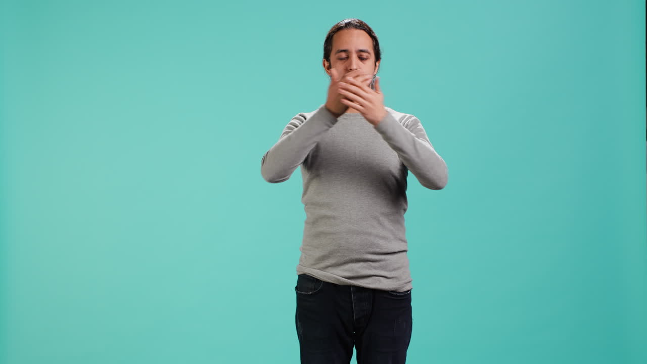 Man covering eyes, ears and mouth, imitating three wise monkeys