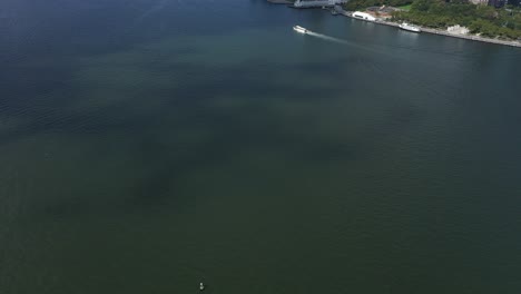 an aerial view of upper bay with a boat sailing by