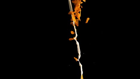 milk and cereal pouring