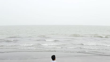 Exploring-loneliness-and-lonely-depressed-concept-through-drone-lens-at-Kuakata-sea-beach,-Bangladesh