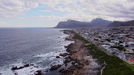 kleinmond coastal town nestled between mountain and atlantic ocean, scenic drone