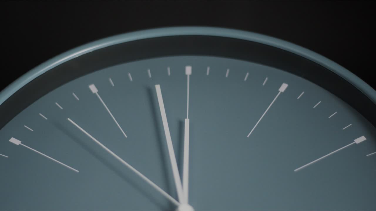 Close up gray clock Showtime 11.58 pm.