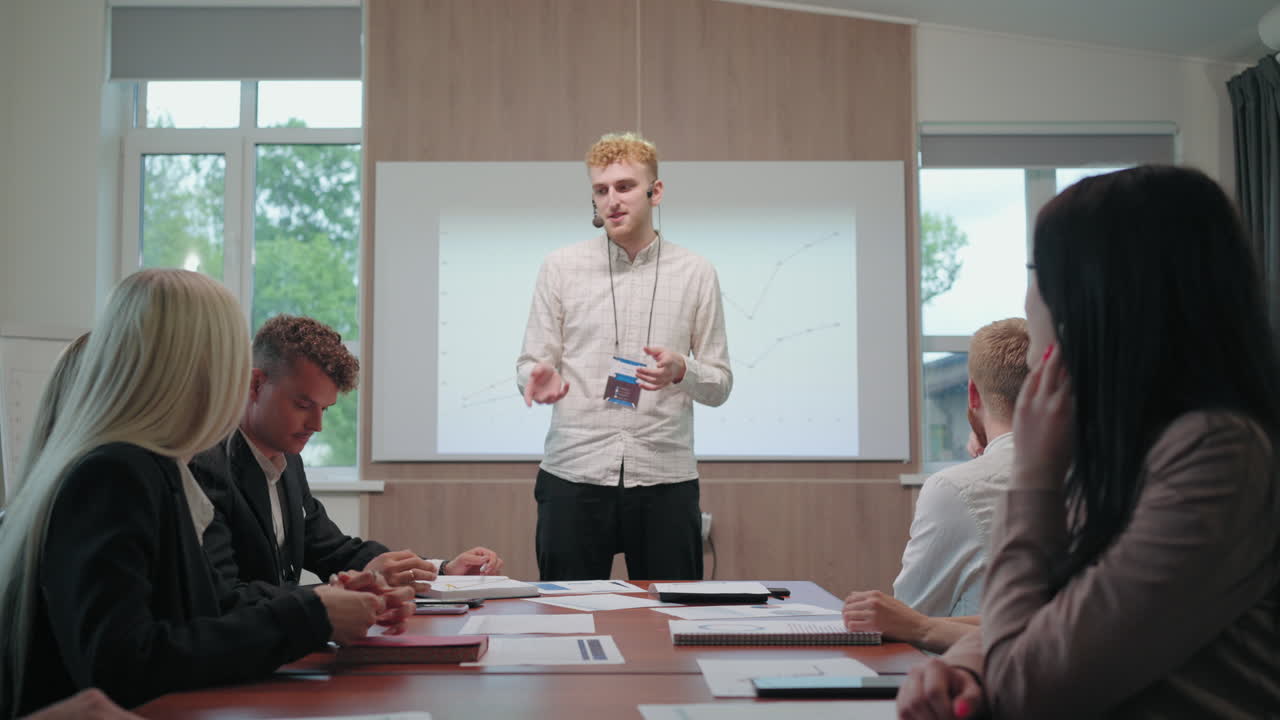 professional coach in field of invest is speaking in business meeting or educational seminar