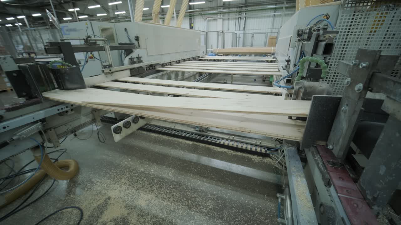 Industrial Machine Processing Wood Planks in a Factory