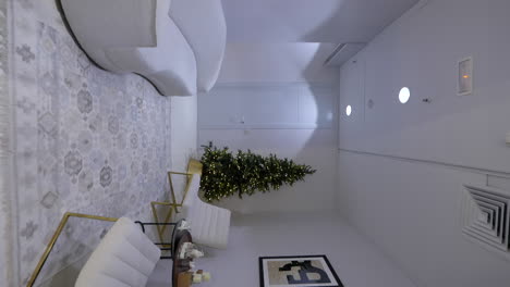 vertical view of christmas shopping mall with couches and xmas tree, forward