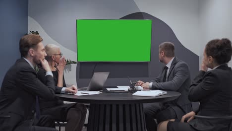 corporate team shocked by bad statistics data on green screen company bankruptcy